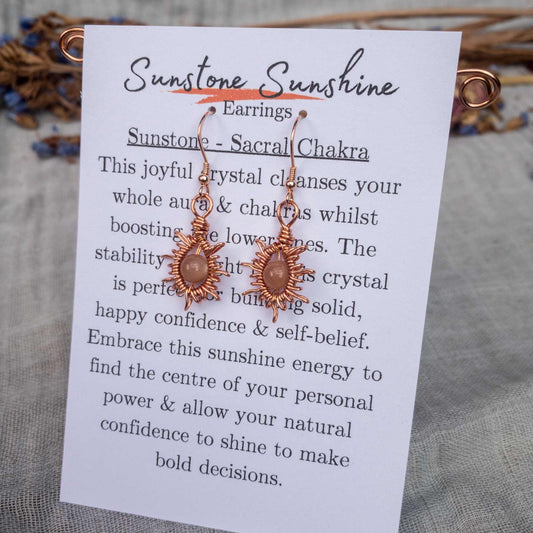 sunburst wire woven wrapped earrings with sunstone beads on information card
