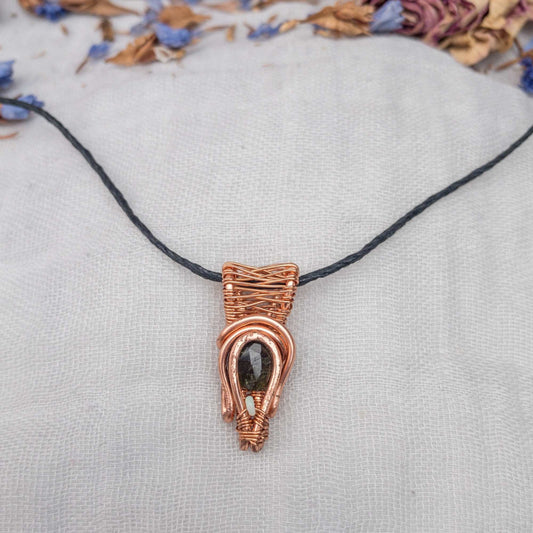 deep green tourmaline and opal wire wrapped pendant in copper wire on handtied hemp cord